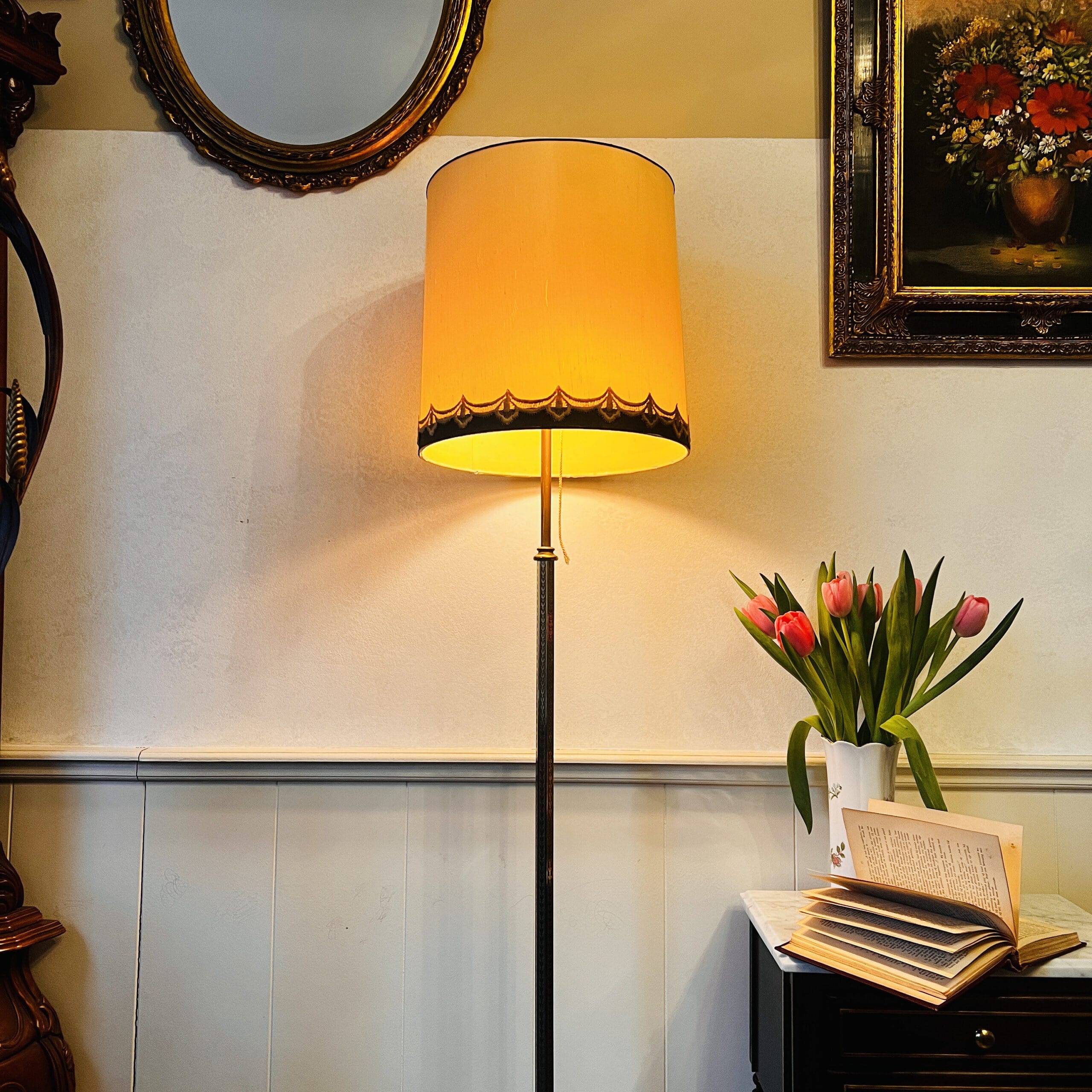 Bronze brass floor lamp with Art Deco style, tripod base and dual lights under a large vintage shade, elegant tall stand lighting