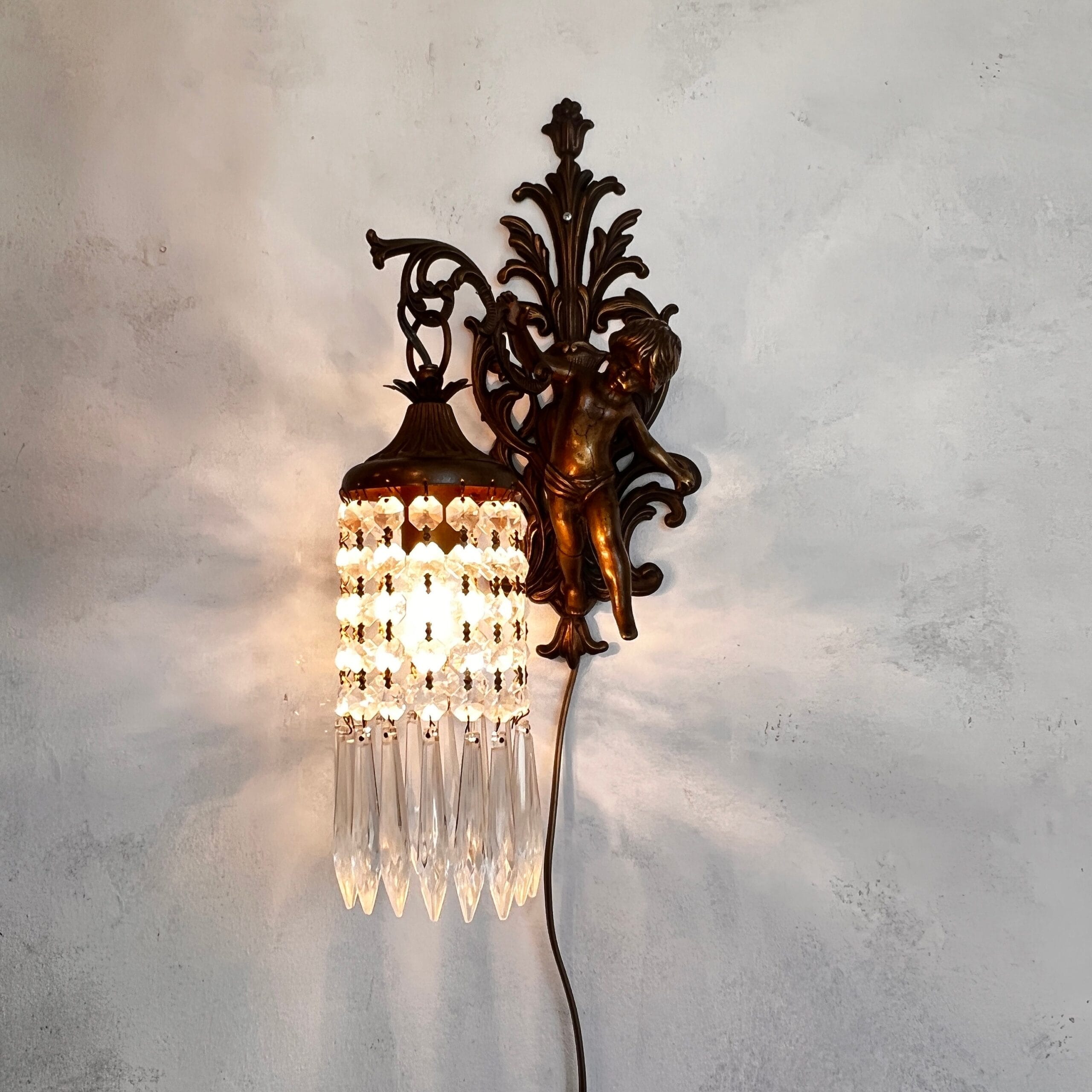 French cast brass cherub wall sconce with crystal prisms, 1930s baroque angel light fixture, ornate vintage home lighting