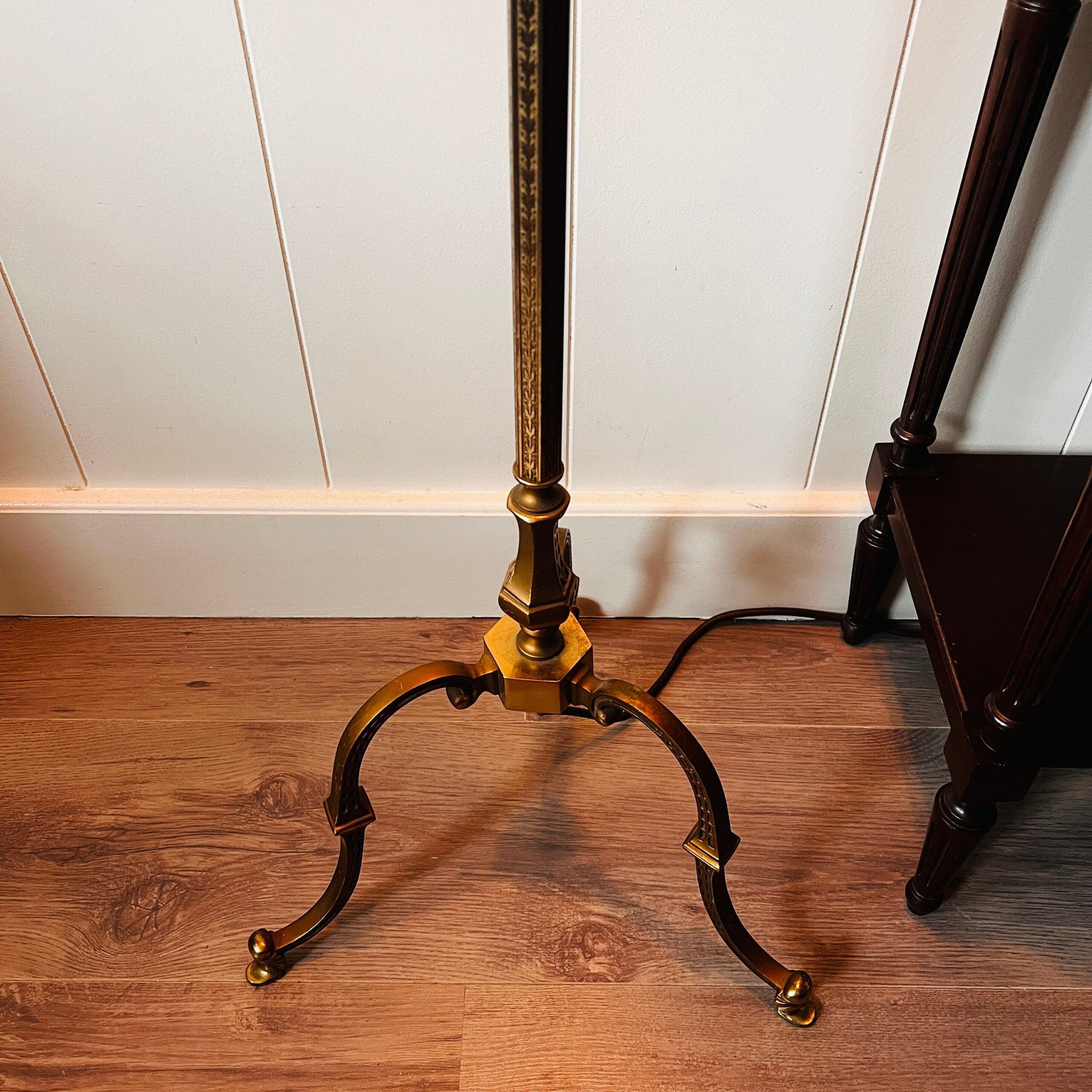 Bronze brass floor lamp with Art Deco style, tripod base and dual lights under a large vintage shade, elegant tall stand lighting