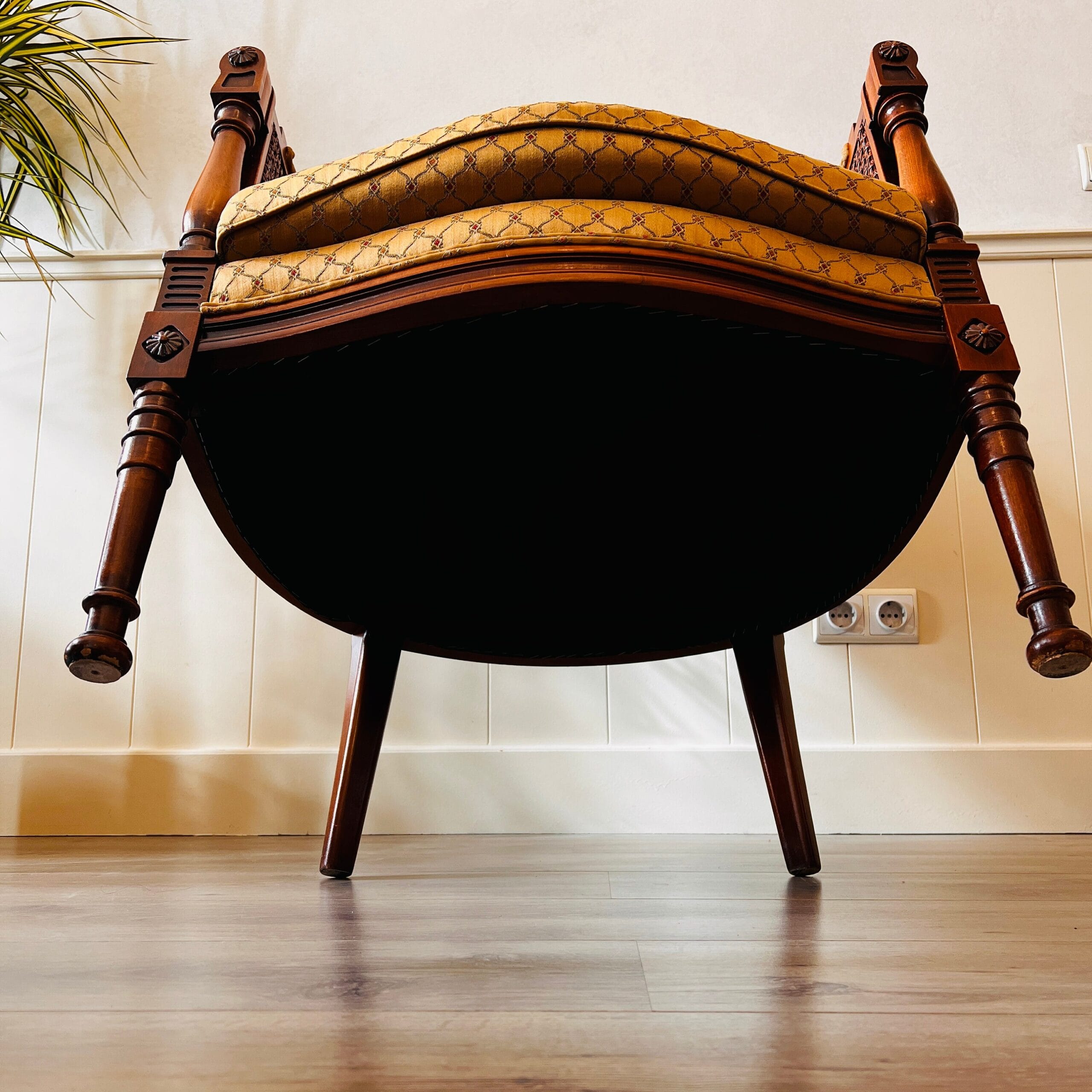 French Louis XVI cane and wood bergère chairs, elegant armchairs with wraparound arms, vintage pair for curated living spaces